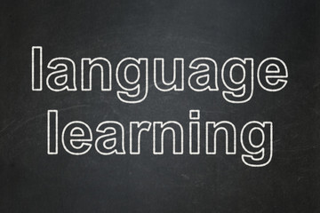 Obraz premium Learning concept: text Language Learning on Black chalkboard background
