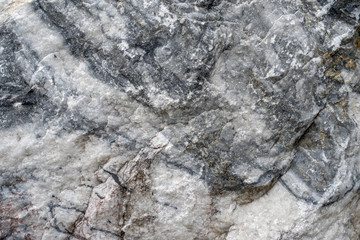 Gray surface of marble stone with striped streaks.