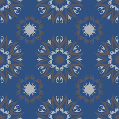 Seamless floral pattern. Dark blue background with flower designs