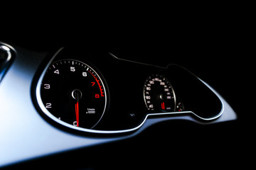 Close up shot of a speedometer in a car. Car dashboard. Dashboard details with indication lamps.Car...