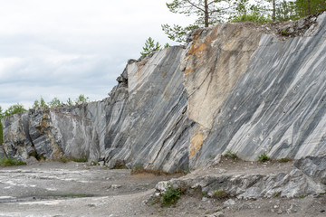 Gray surface of marble stone with striped streaks.