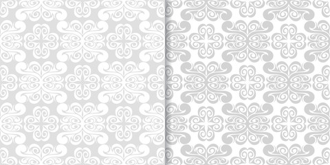 Light gray floral backgrounds. Set of seamless patterns