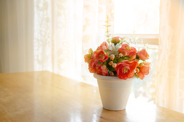 Artificial flower in the pot. Autumn season concepts