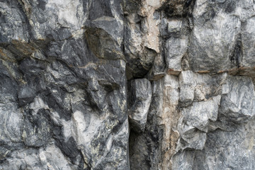 Gray surface of marble stone with striped streaks.