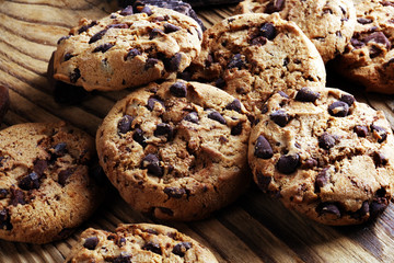 Chocolate cookies on table. Chocolate chip cookies shot with chocolate