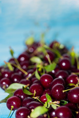 Cherry on a blue background, close-up