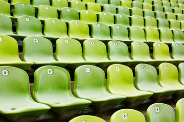 Rows of green seats in a football arena
