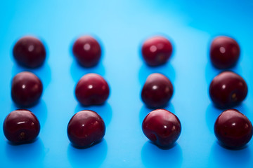 Isolated cherry. Collection of cherries isolated on blue background