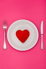 Fototapeta na wymiar Valentine's Day Table Setting with Heart Decoration