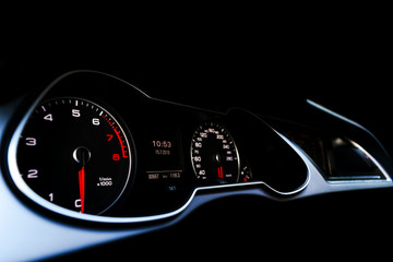 Close up shot of a speedometer in a car. Car dashboard. Dashboard details with indication lamps.Car...