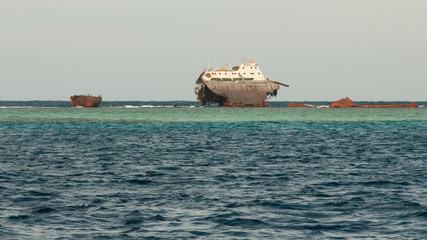 Inverted old ship at sea