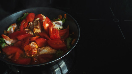 Vegetable stew, cooking chicken with vegetables. Process of cooking.