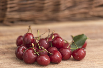 bunch of cherries on wooden surface