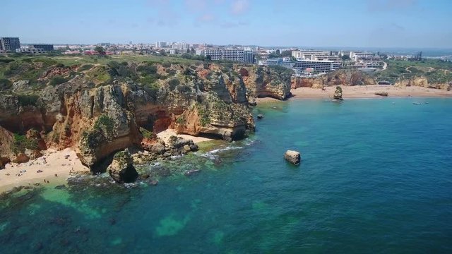 Aerial. Video from the air beach Camilo, tourists sunbathe, sail boats
