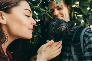 Loving couple with pet french bulldog
