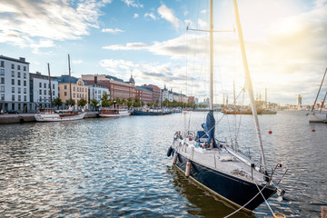 Fototapeta na wymiar Beautiful cityscape, Helsinki, the capital of Finland, view of the embankment with boats and houses, travel to Northern Europe