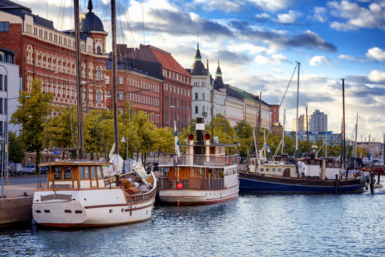 Beautiful cityscape, Helsinki, the capital of Finland, view of the embankment with boats and houses, travel to Northern Europe