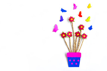 Paper art flowers on vase with butterfy on white background