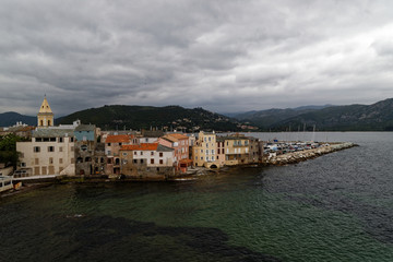 Fototapeta na wymiar Houses and Marina in Saint Florent Corsica