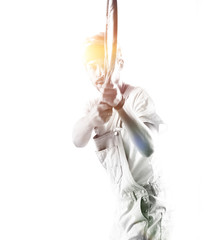 Handsome young sportsman holding racket isolated on white