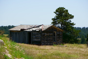 Forgotten mountain cabin sits high up on a ridge
