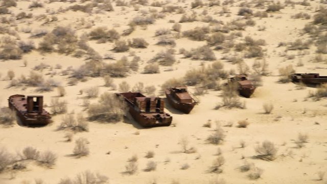An aerial shot from the Aral Lake of rusty ship wreck.