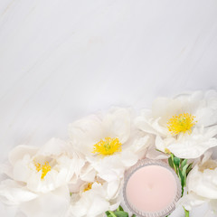 Fototapeta na wymiar White peony flowers on marble background