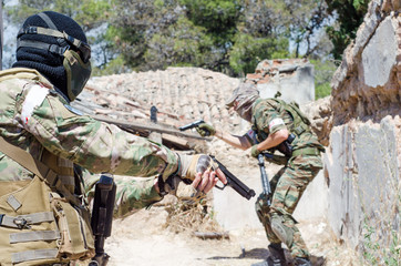 Fototapeta premium Airsoft group of soldiers abandoned house