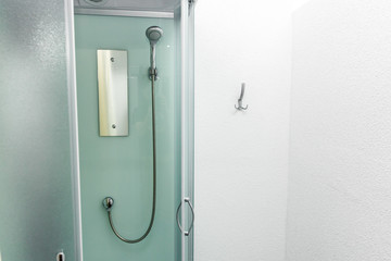 new shower cabin in physiotherapy rehab clinic. modern rehabilitation equipment. fitness wellness hygiene concept. space for text. public shower room