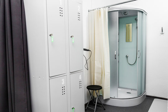 shower room with cabin and lockers in physiotherapy rehab clinic. modern rehabilitation equipment. fitness wellness hygiene concept. space for text