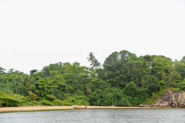 Motorboat on the sandy bank of the river. Tropical island in Sri Lank