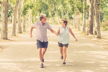 Fototapeta premium Happy senior couple walking and enjoying life outdoors