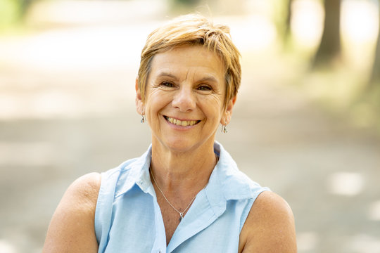 Portrait of a happy mature woman in the park