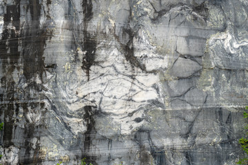 Gray surface of marble stone with striped streaks.
