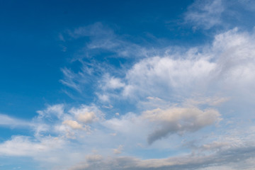 White clouds in the blue sky.