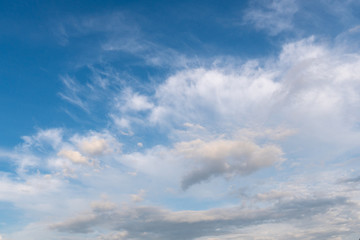 White clouds in the blue sky.