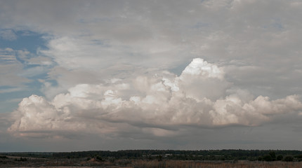 White clouds in the blue sky.