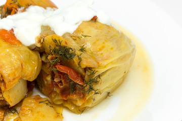 delicious red bell peppers stuffed with minced meat on white plate