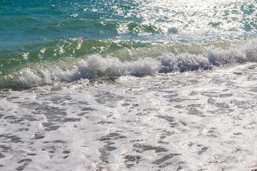 Beach with a wave in the summer Sunny day