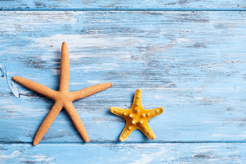 starfishes on a blue rustic wooden table