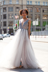 Fototapeta premium Sexy african woman in white long dress