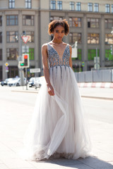 Naklejka premium Sexy african woman in white long dress