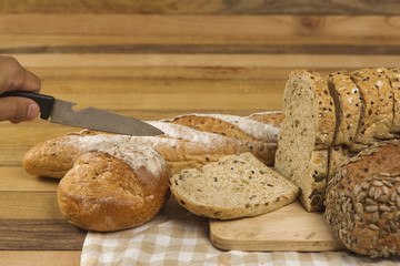 Whole grain bread on wooden background, healthy for dieting or breakfast