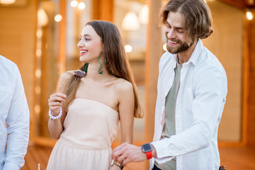 Friends enjoying evening time having some food on the backyard of the house outdoors