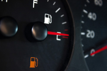 Car Fuel Gauge Showing Empty, close up