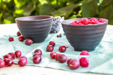 Flatlay with raspberries, blueberries and gooseberries.