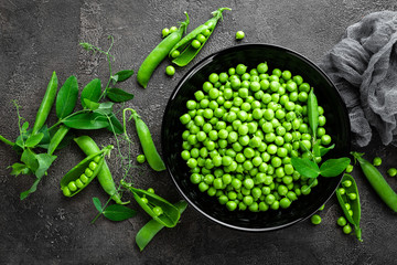 Green peas with pods and leaves
