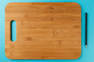 pencil on blue background. Top view