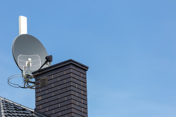 Satellite dish and tv, radio and wireless internet antenna with empty copy cpace
