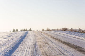 Fototapeta na wymiar sun rise on the country roads in winter
